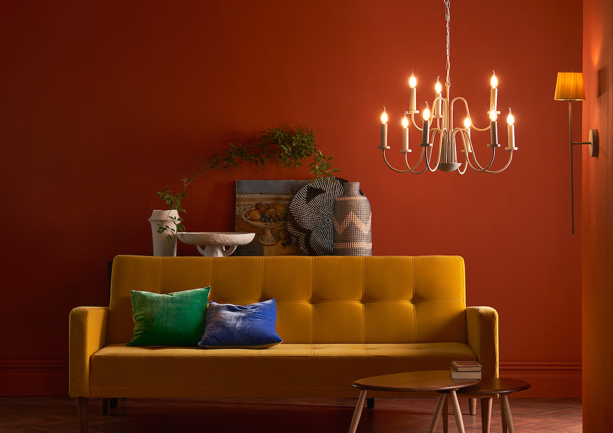 Layered autumn home lighting with pendant, table, wall and floor lamps creating warmth and atmosphere