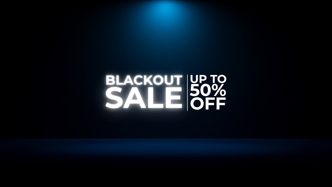 Blackout Sale sign with up to 50% off discount on dark background with blue spotlight