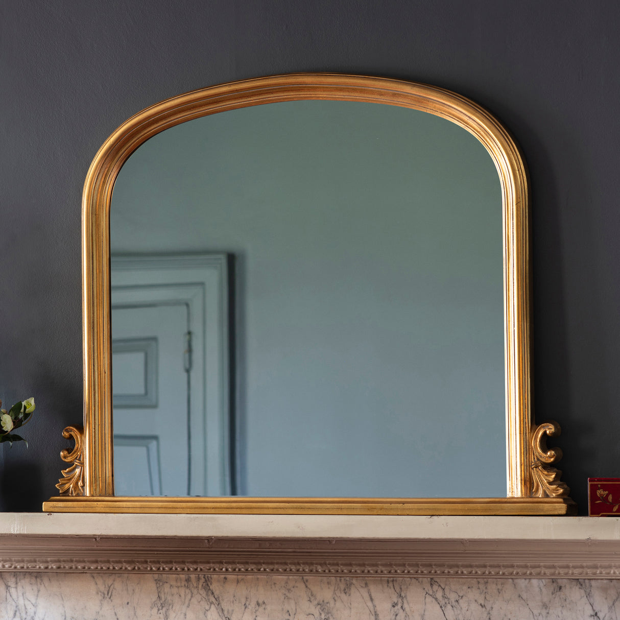 Amos Gold leaf arch over mantel mirror – from Amos Lighting + Home
