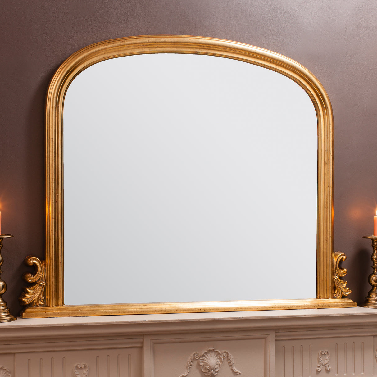 Amos Gold leaf arch over mantel mirror – from Amos Lighting + Home