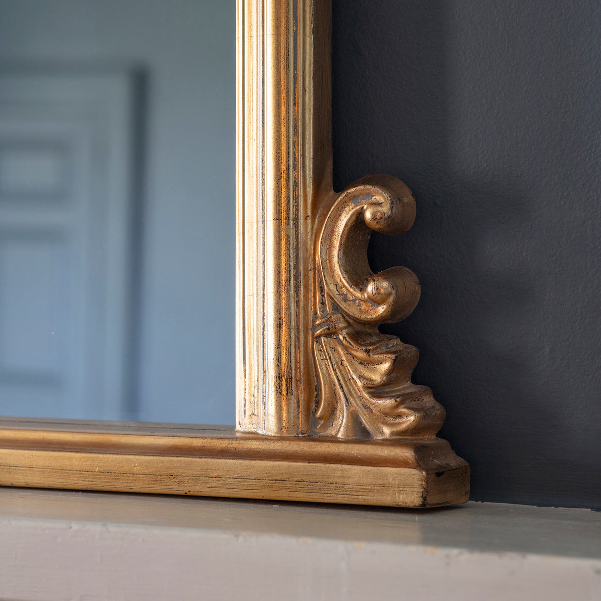Amos Gold leaf arch over mantel mirror – from Amos Lighting + Home