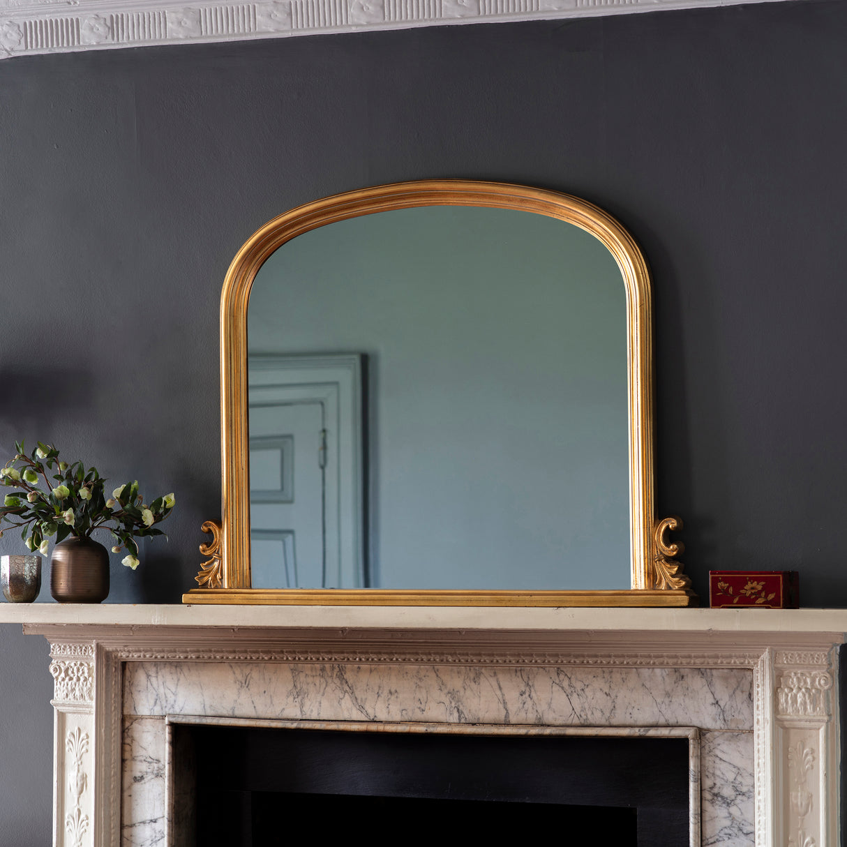 Amos Gold leaf arch over mantel mirror – from Amos Lighting + Home