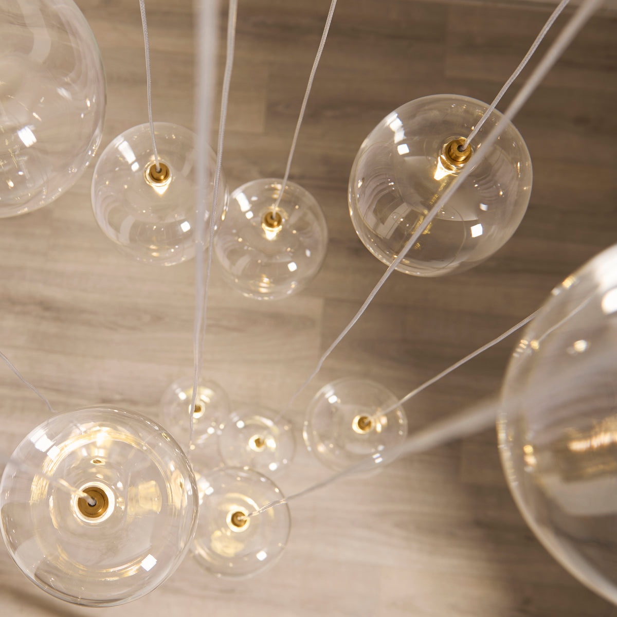 Endon Oslo 12lt Cascade Pendant Brushed aged brass plate & clear glass