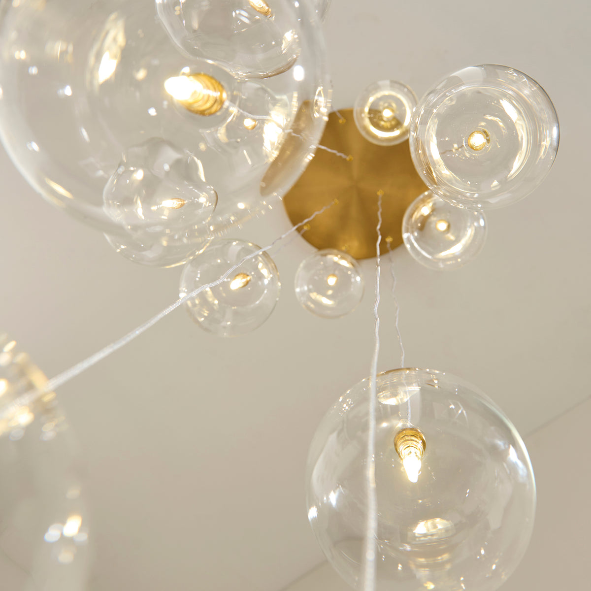 Endon Oslo 12lt Cascade Pendant Brushed aged brass plate & clear glass
