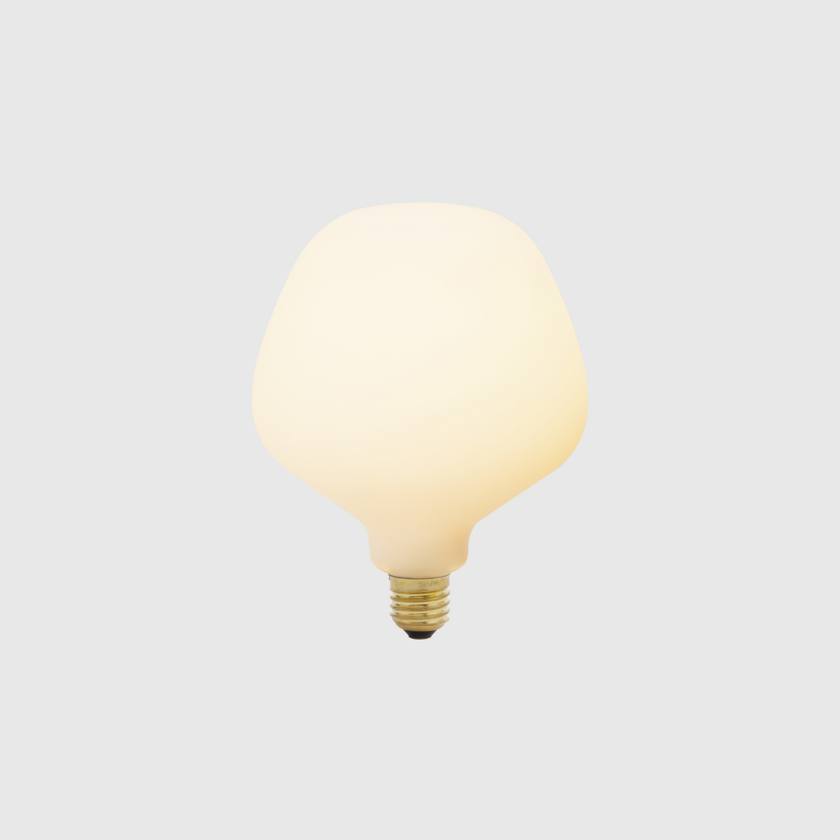 Unique frosted glass LED bulb with E27 brass base glowing warm white light