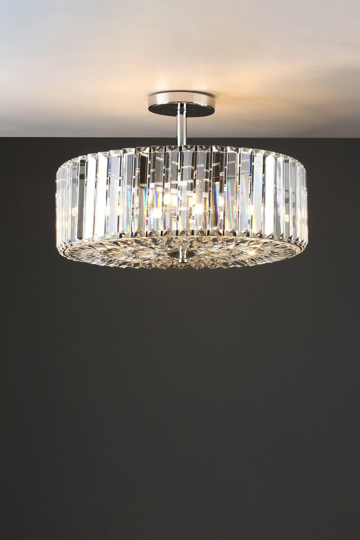 Modern crystal ceiling light fixture with chrome finish and vertical prism glass panels