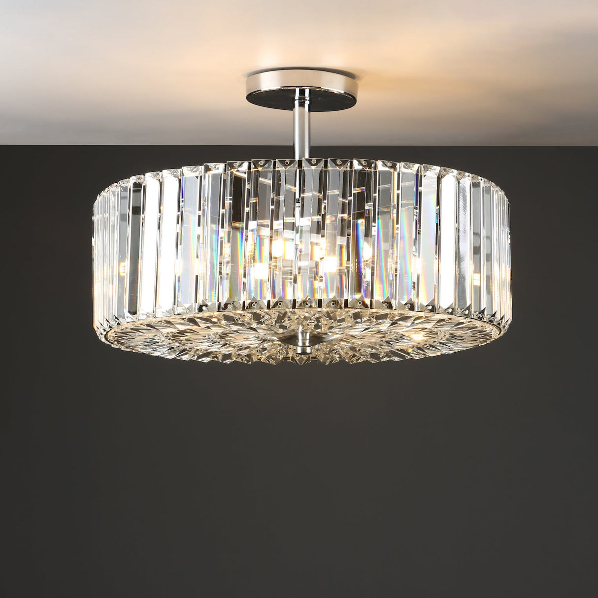 Modern crystal ceiling light fixture with cylindrical prism design and chrome base