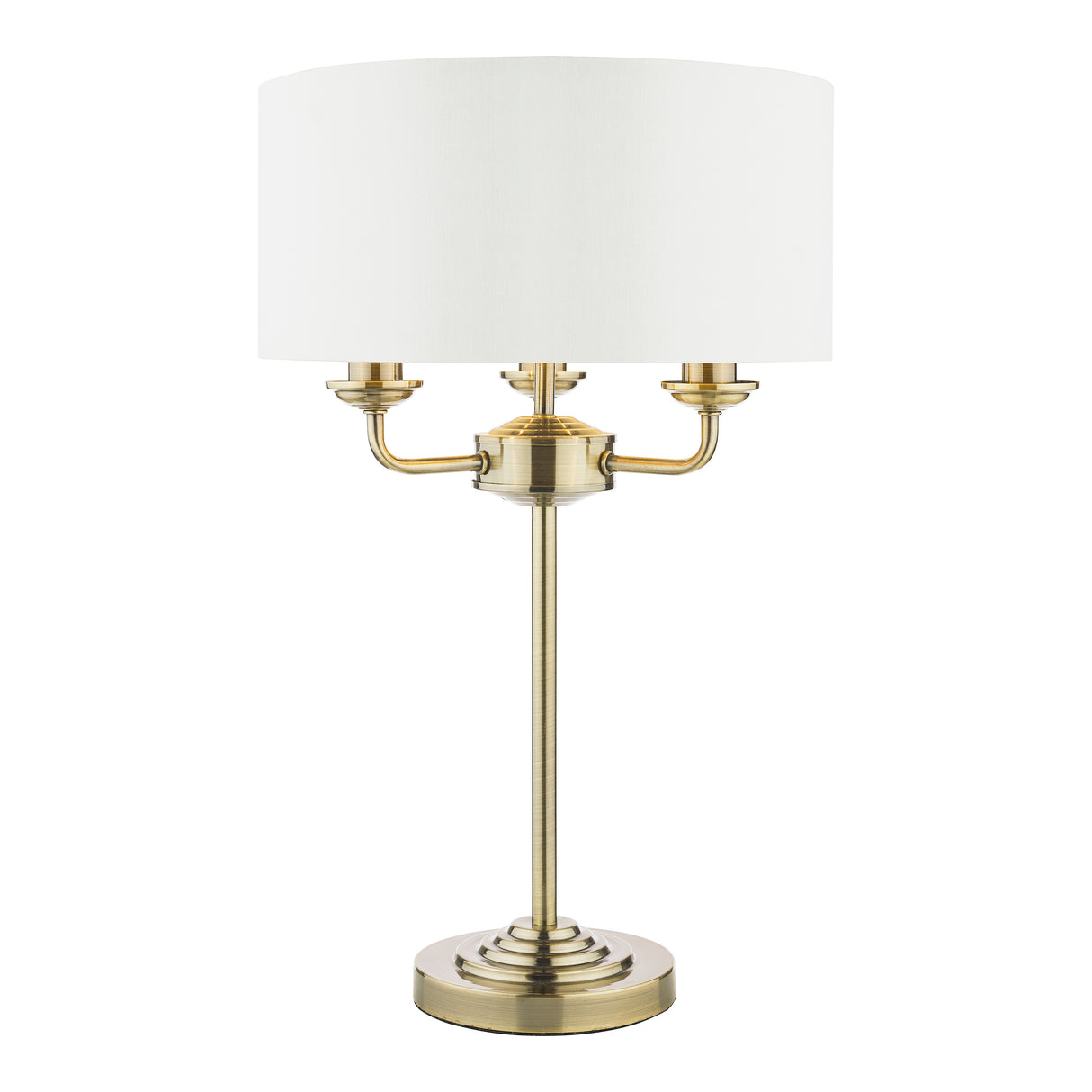 Elegant brass table lamp with white drum shade and three arm design on round base