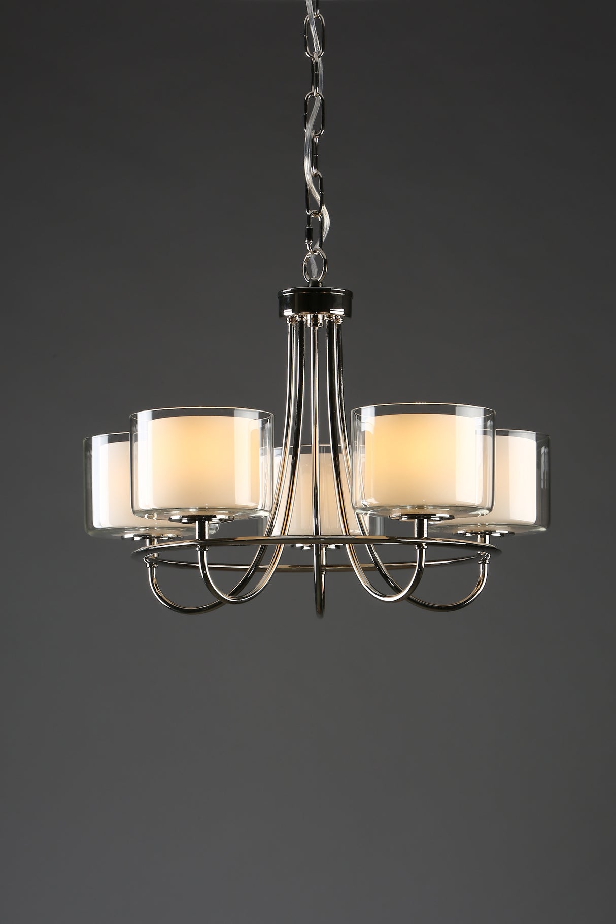 Modern chrome chandelier with five frosted glass candle-style lights on chain
