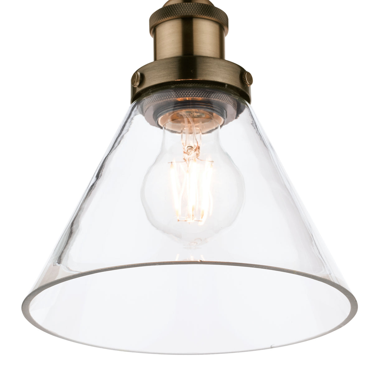 Vintage clear glass pendant light with exposed filament bulb and brass fixture
