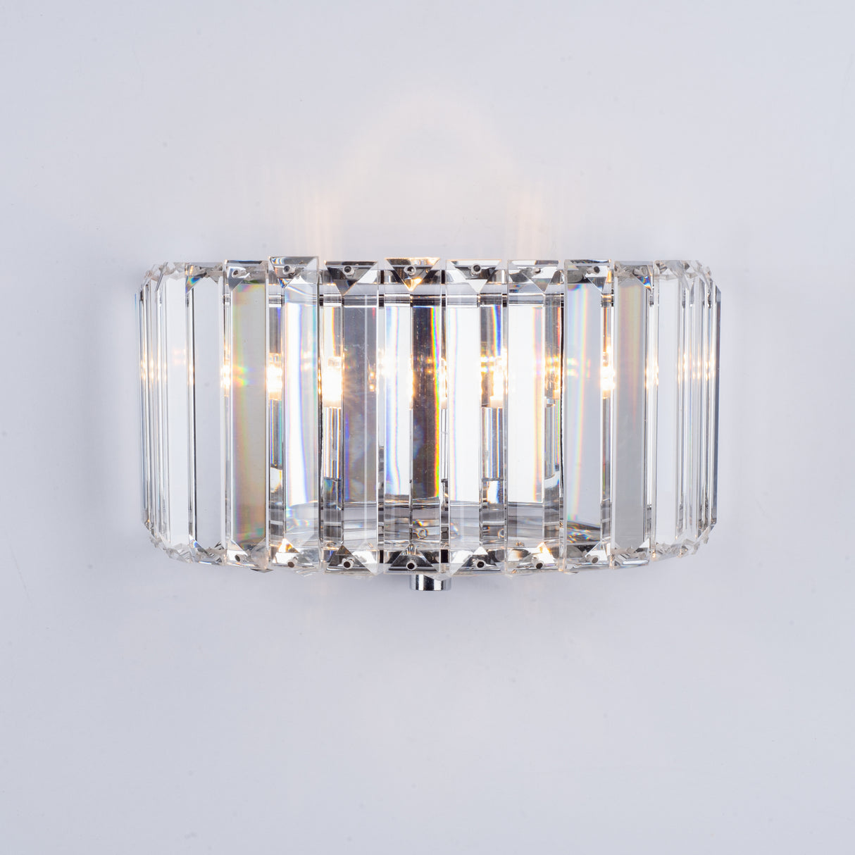 Modern rectangular crystal wall light fixture with glowing bulbs on white background