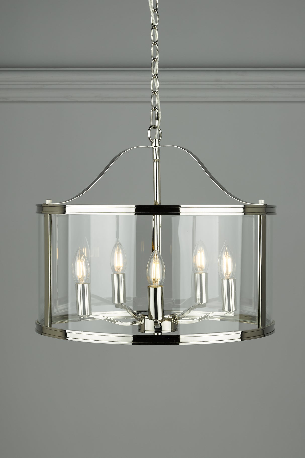 A Laura Ashley Harrington 5 Light Pendant with a polished nickel finish, featuring a drum-shaped glass case and five suspended lampholders.