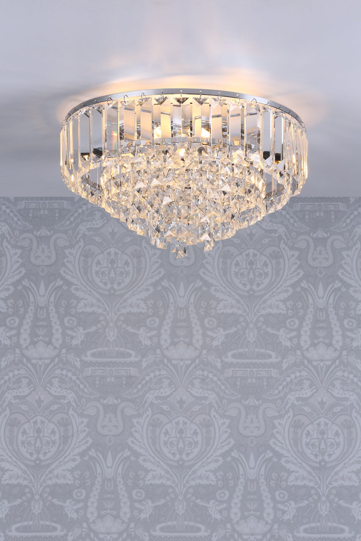 Elegant crystal chandelier ceiling light with intricate glass prisms in a decorative room