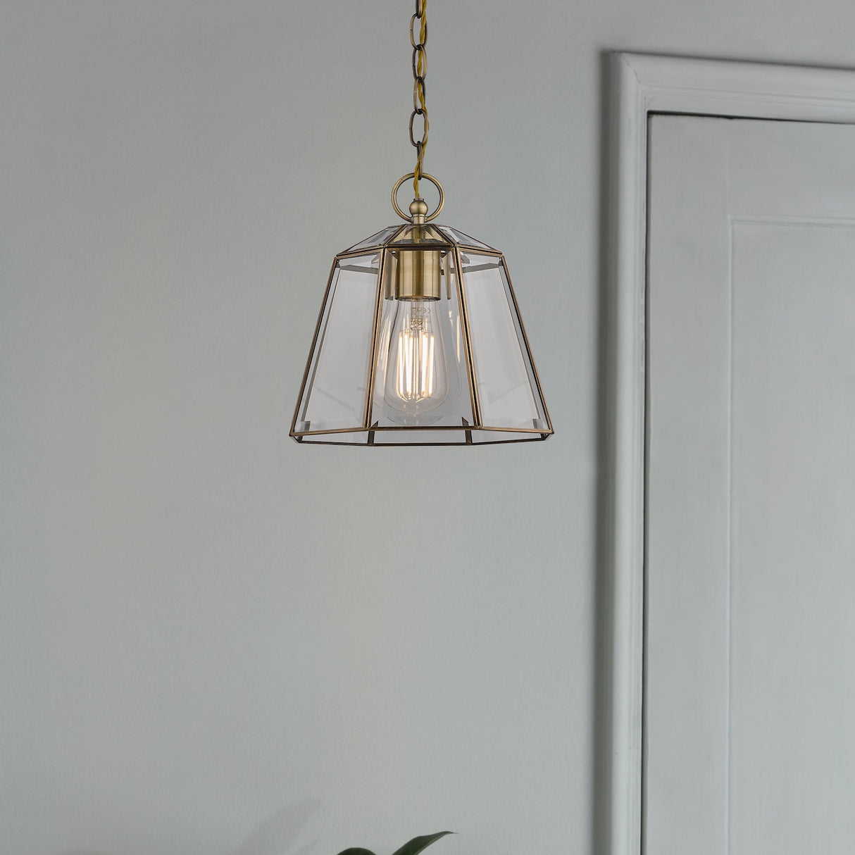 Modern pendant light with clear glass geometric shade and vintage-style filament bulb