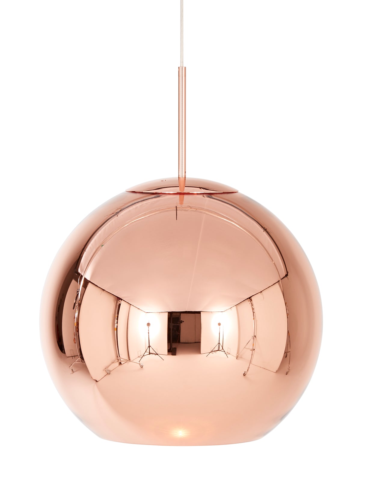 Modern round copper pendant light with reflective surface hanging on white background