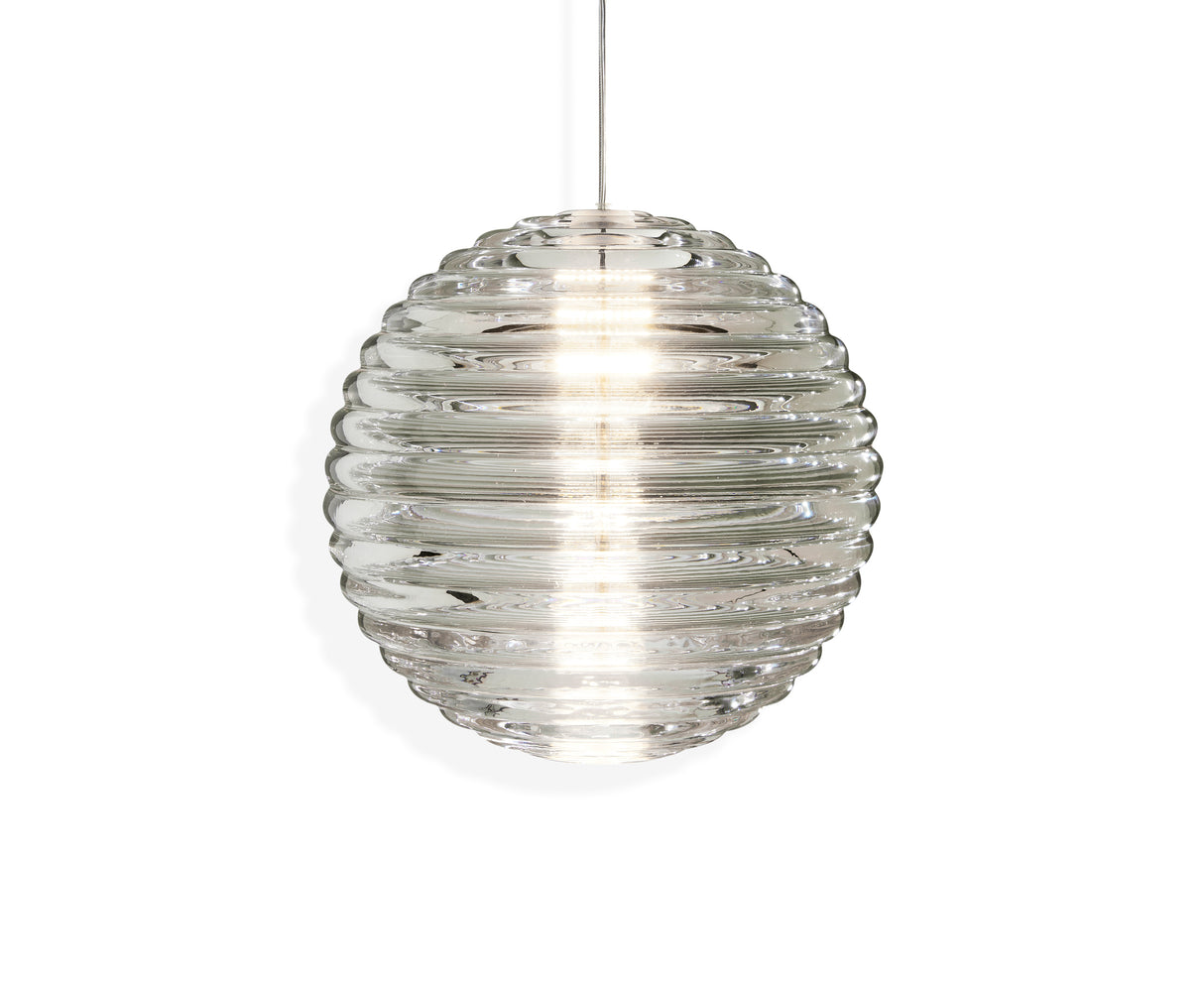 Modern clear glass pendant light with horizontal ridges, glowing softly on white background