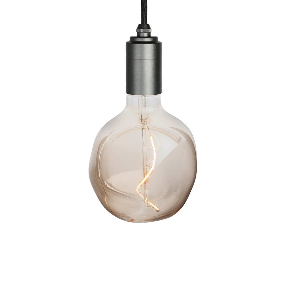 Graphite pendant with a geometric Voronoi design on a white background