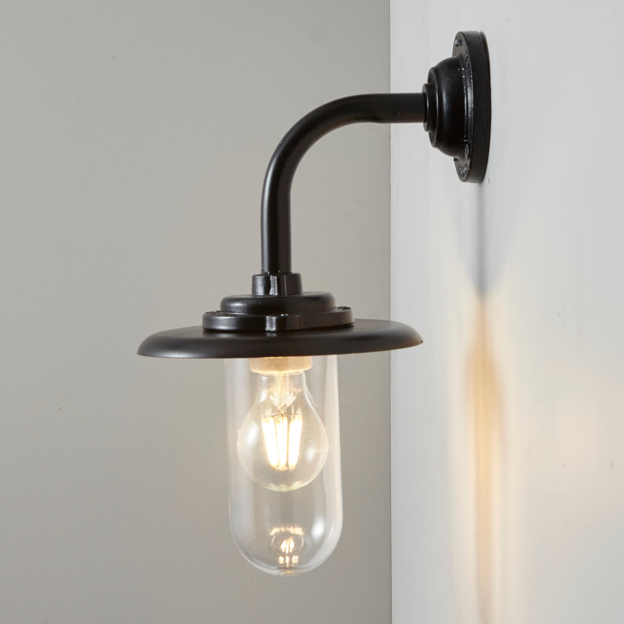 Davey Lighting Black Iron Exterior Round Neck Wall Light 7677, Clear Glass – from Amos Lighting + Home