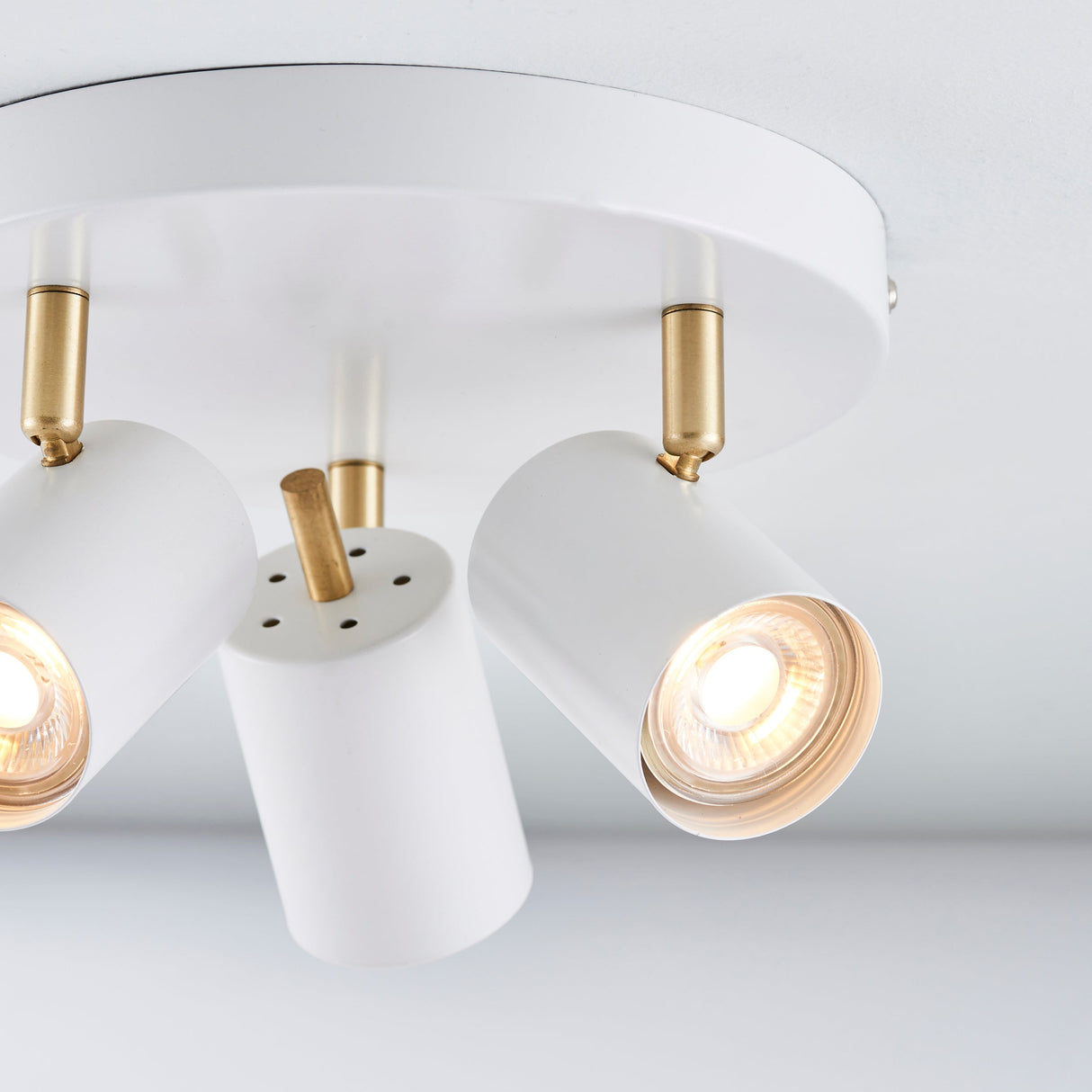 Amos Gull 3 Arm Spotlight Matt White & Satin Brass – from Amos Lighting + Home