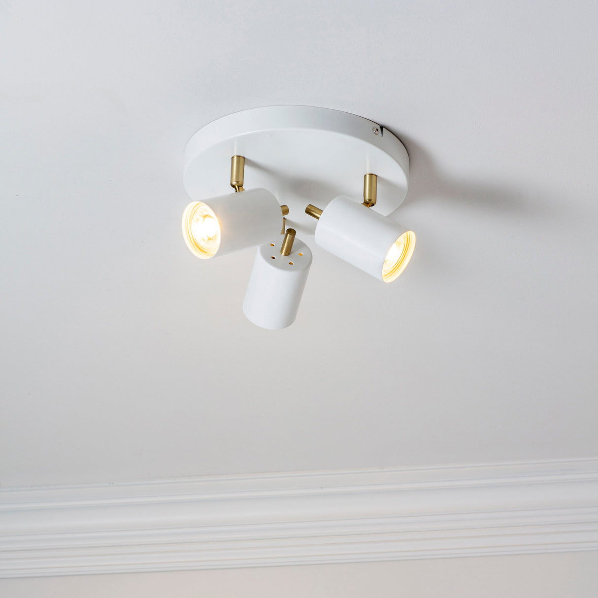 Amos Gull 3 Arm Spotlight Matt White & Satin Brass – from Amos Lighting + Home