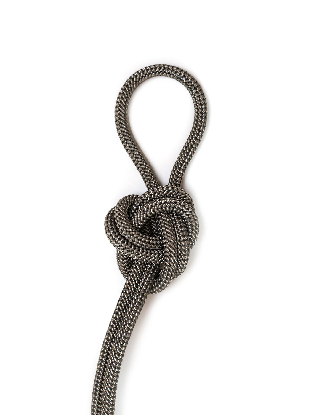 Black and gray braided rope tied in a decorative loop knot on a white background