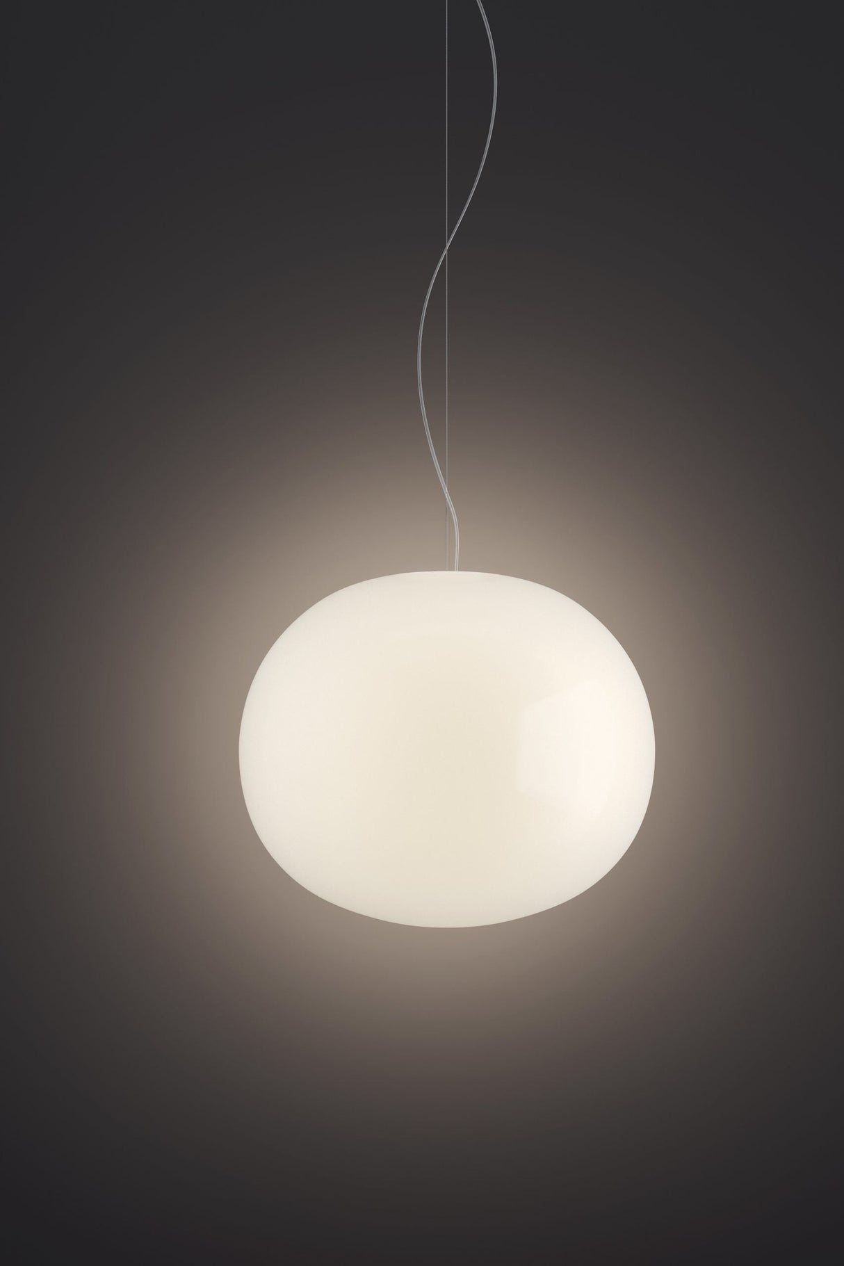 Modern white round pendant light glowing softly with minimalist design and dark background