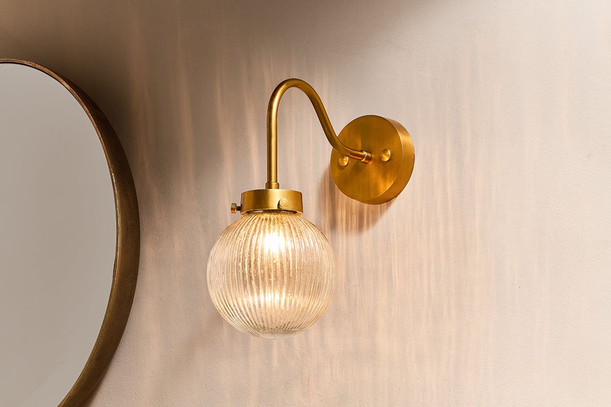 Nkuku Konnie Brass Bathroom Wall Lamp Ribbed Glass Globe – from Amos Lighting + Home