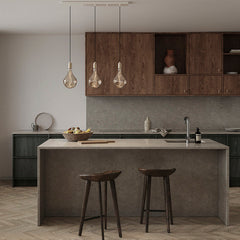 Modern kitchen island with concrete countertop, dark bar stools, wood cabinets, and triple pendant LED lights