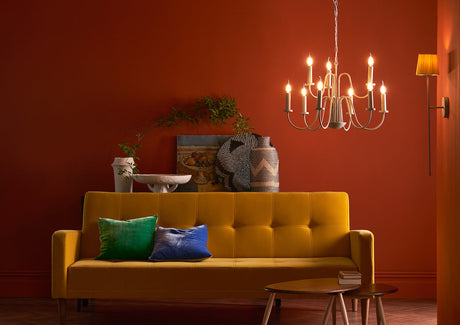Layered autumn home lighting with pendant, table, wall and floor lamps creating warmth and atmosphere