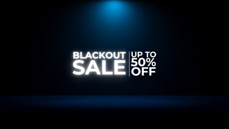Blackout Sale sign with up to 50% off discount on dark background with blue spotlight