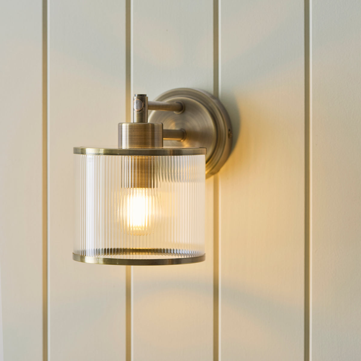 Endon Ridgeton Armed Wall Antique brass plate & clear ribbed glass