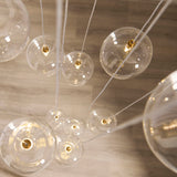 Endon Oslo 12lt Cascade Pendant Brushed aged brass plate & clear glass