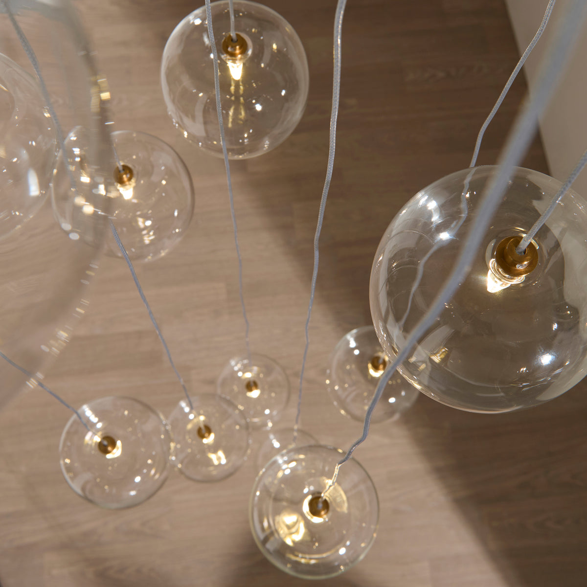 Endon Oslo 12lt Cascade Pendant Brushed aged brass plate & clear glass