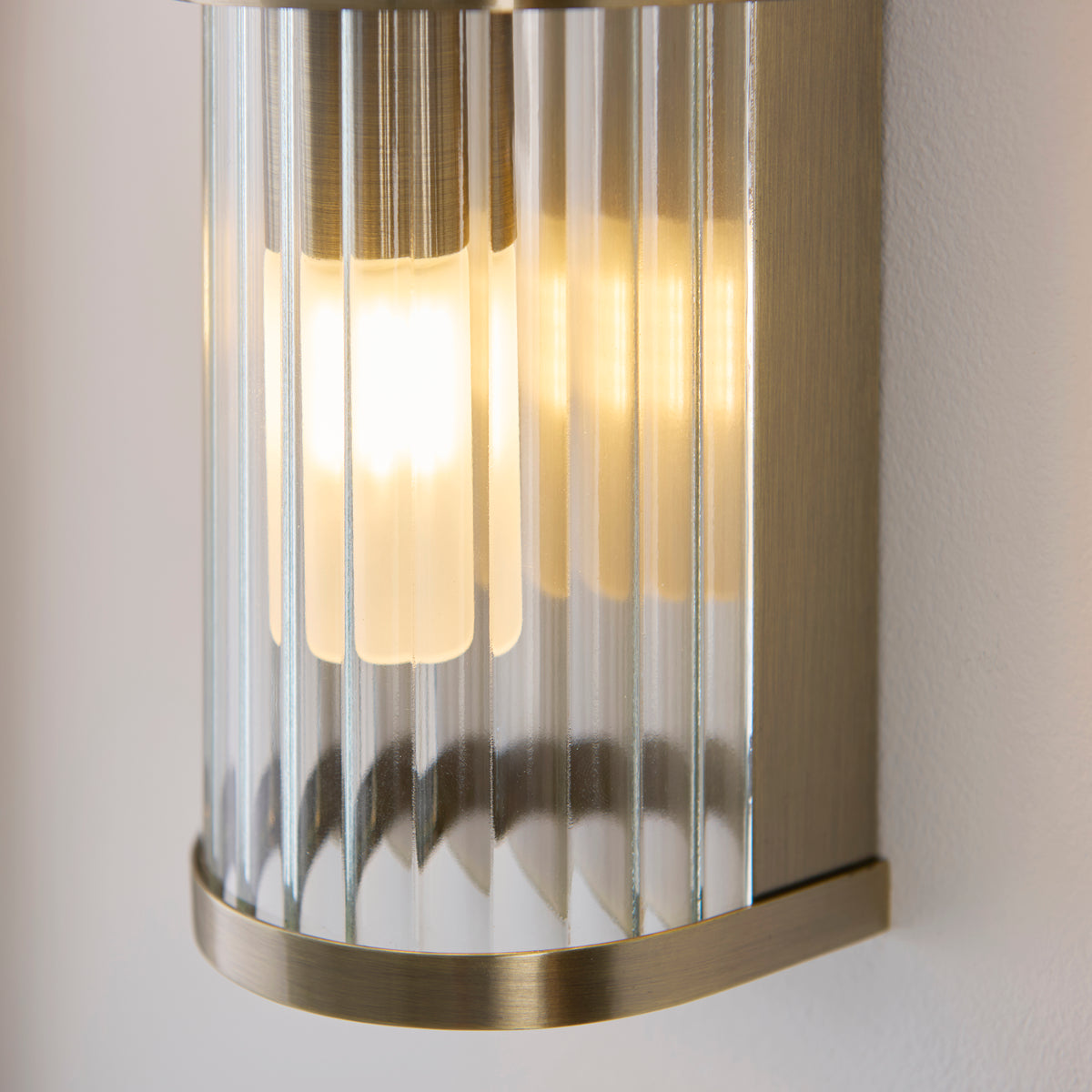 Endon Ridgeton IP44 2lt Wall Antique brass plate & clear ribbed glass