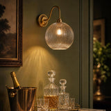 Dar Caliro Wall Light Antique Bronze with Ribbed Glass Globe Shade