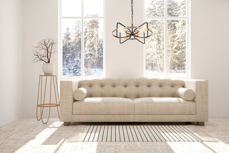 Bright modern living room with beige textured sofa, patterned rug, pendant light, and snowy forest view
