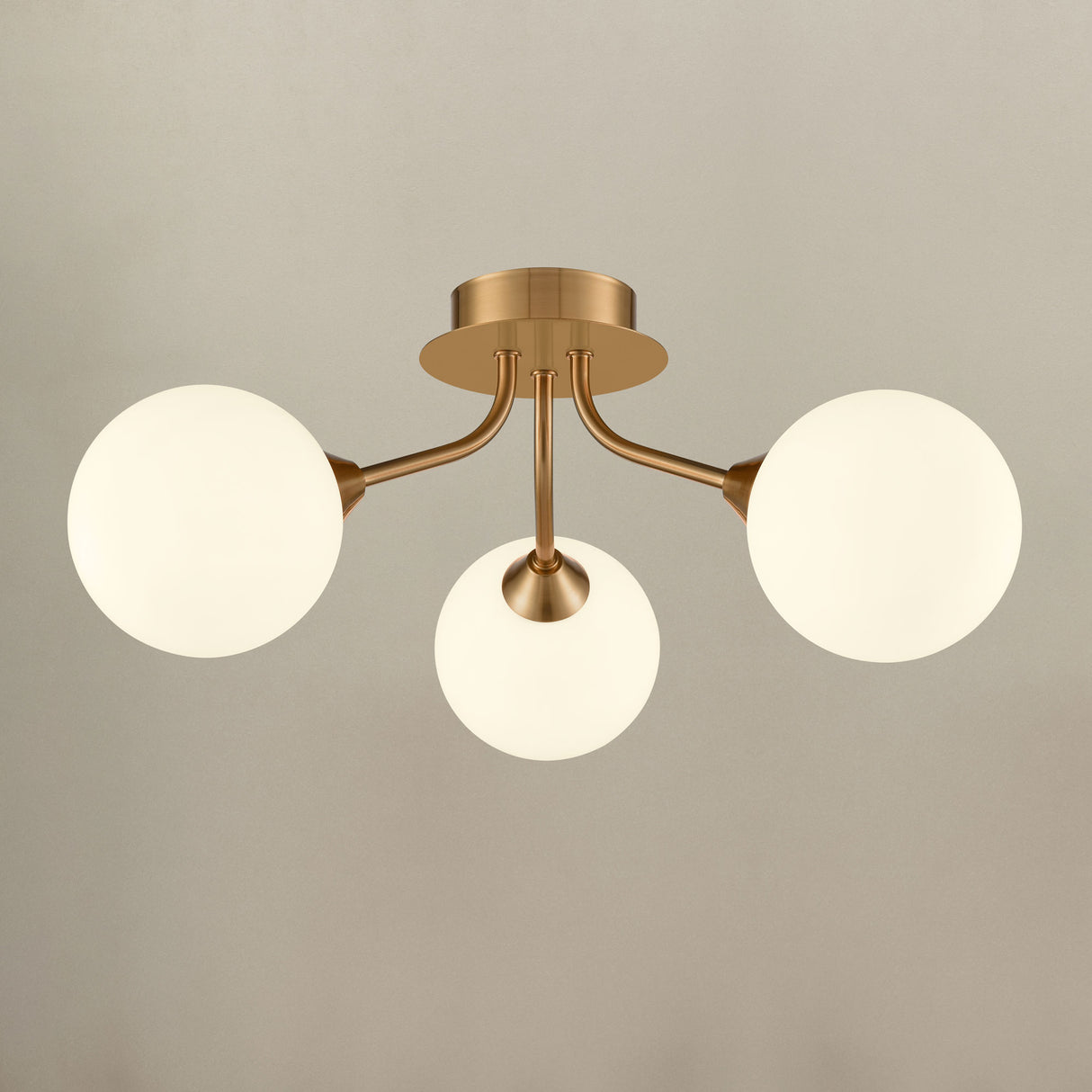 Franklite Cosmic 3 light fitting in antique gold with matt opal glass