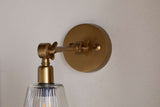 Nkuku Davika Ribbed Glass Task Wall Lamp Clear & Antique Brass