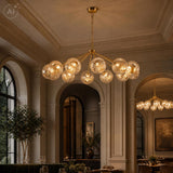 Dar Liora 12 Light Pendant Antique Gold and Amber Ribbed Glass