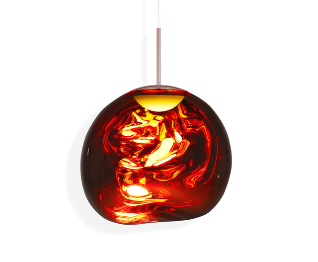 Melt red glass LED pendant light with copper fixture suspended on white background