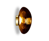 Modern amber glass LED wall light with gold base against white background