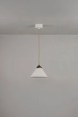 Original BTC Cobb. Pendant light fixture hanging from a ceiling on a plain wall.