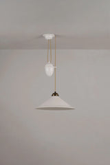 Original BTC Cobb Rise and Fall. Two pendant lights hanging from a ceiling against a plain wall.