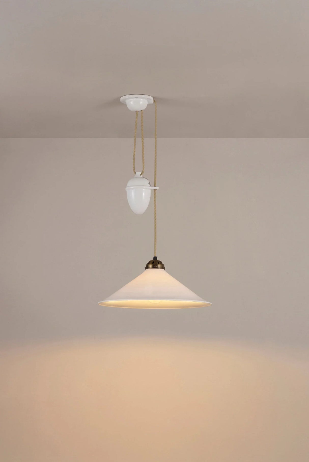 Pendant light fixture on a beige wall