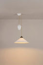 Pendant light fixture on a beige wall