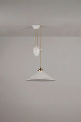 Modern pendant light with white shades and gold fixtures on a plain background