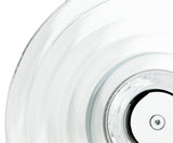 Close-up of a clear glass plate with concentric circular ridges and a central metal screw detail