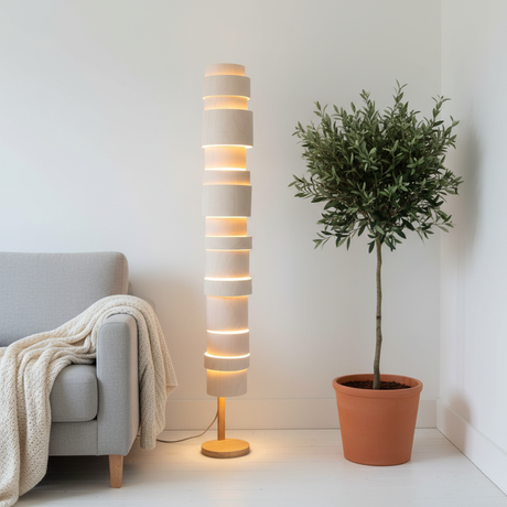 amos-lighting-Stuart-Lamble-Tower-Floor-Lamp-Oak-Stacked-Veneer-Rings-White-Walls-Grey-Linen-Sofa-Olive-Tree