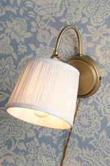 Laura Ashley Hemsley Wall Light Antique Brass and Ivory –  from Amos Lighting + Home