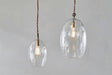 Nkuku Otoro Recycled Clear Glass Pendant  Large Oval –  from Amos Lighting + Home